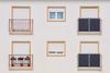 Hausfassade mit Balkons und Solarmodulen